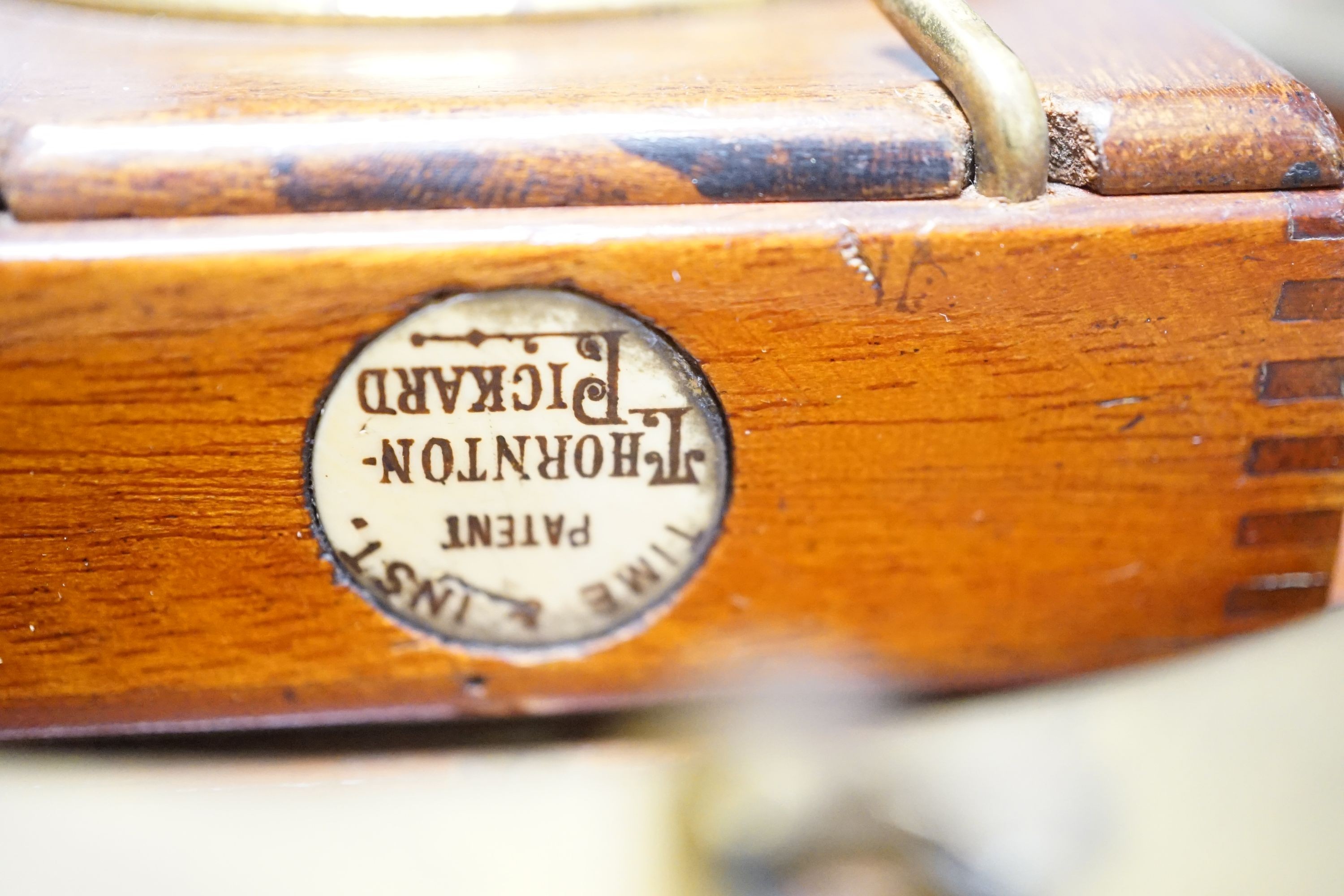 A Thornton Pickard mahogany and brass plate camera, three plates and a stand, 20cm sq.